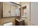 Powder room with copper sink and decorative mirror at 11454 N 87Th Pl, Scottsdale, AZ 85260
