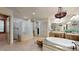 Elegant bathroom with a large soaking tub, walk-in shower, and double vanity at 11454 N 87Th Pl, Scottsdale, AZ 85260