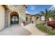 Elegant entryway with ornate double doors and beautiful landscaping at 11454 N 87Th Pl, Scottsdale, AZ 85260