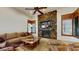 Relaxing Gathering room with a stone fireplace and built-in shelving at 11454 N 87Th Pl, Scottsdale, AZ 85260