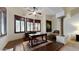 Home office with large desk, built-in shelves, and hardwood flooring at 11454 N 87Th Pl, Scottsdale, AZ 85260