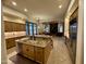 Open kitchen featuring wood cabinets, granite counters, large island, and stainless steel appliances at 11454 N 87Th Pl, Scottsdale, AZ 85260