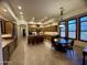 Spacious kitchen boasts wood cabinets, granite countertops, breakfast bar, and stainless steel refrigerator at 11454 N 87Th Pl, Scottsdale, AZ 85260