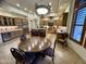 Kitchen view featuring wood cabinetry, a large island, stainless steel refrigerator, and a chandelier at 11454 N 87Th Pl, Scottsdale, AZ 85260