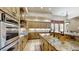 Gourmet kitchen boasts stainless steel appliances and granite island at 11454 N 87Th Pl, Scottsdale, AZ 85260