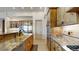 Gourmet kitchen boasts granite countertops, stainless steel appliances, and custom wood cabinetry at 11454 N 87Th Pl, Scottsdale, AZ 85260