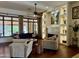 Bright living room boasts a cozy fireplace, custom built-ins, and hardwood floors at 11454 N 87Th Pl, Scottsdale, AZ 85260
