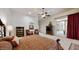 Spacious main bedroom with sitting area, large windows, and access to patio at 11454 N 87Th Pl, Scottsdale, AZ 85260