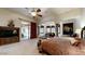 Main bedroom with king-size bed, access to private office and backyard patio at 11454 N 87Th Pl, Scottsdale, AZ 85260