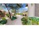 Landscaped pathway leading to a backyard pool and patio at 11454 N 87Th Pl, Scottsdale, AZ 85260