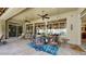 Covered patio with seating area, ceiling fans, and access to backyard at 11454 N 87Th Pl, Scottsdale, AZ 85260