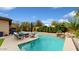 Relaxing pool area with seating and a waterfall feature at 11454 N 87Th Pl, Scottsdale, AZ 85260