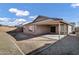 Home's backyard with gravel, a patio, and a wall at 11838 N 154Th Ave, Surprise, AZ 85379