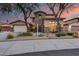 Two-story home with stone accents and landscaped front yard at 12259 W Lone Tree Trl, Peoria, AZ 85383