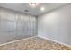 Spare bedroom with corrugated metal accent wall at 12259 W Lone Tree Trl, Peoria, AZ 85383