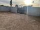 Large backyard with gated entrance and dirt ground at 1508 E Todd E Dr, Tempe, AZ 85283
