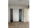 Bedroom with sliding door closet and tile floor at 1508 E Todd E Dr, Tempe, AZ 85283