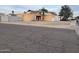 Tan house with a driveway and small front yard at 1508 E Todd E Dr, Tempe, AZ 85283