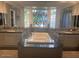 Elegant bathroom featuring a large soaking tub and double vanities at 1526 W Wilshire Dr, Phoenix, AZ 85007