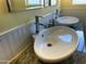 Updated bathroom with double sinks and granite countertops at 1526 W Wilshire Dr, Phoenix, AZ 85007
