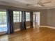 Bright bedroom with hardwood floors and access to backyard at 1526 W Wilshire Dr, Phoenix, AZ 85007