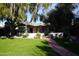 Charming single story home with a manicured lawn at 1526 W Wilshire Dr, Phoenix, AZ 85007