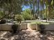 Landscaped front yard with brick walkway and mature trees at 1526 W Wilshire Dr, Phoenix, AZ 85007