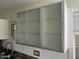 Modern kitchen cabinets with frosted glass doors at 1526 W Wilshire Dr, Phoenix, AZ 85007