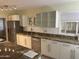 Modern kitchen with granite countertops and stainless steel appliances at 1526 W Wilshire Dr, Phoenix, AZ 85007