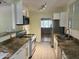 Updated kitchen with granite countertops and stainless steel appliances at 1526 W Wilshire Dr, Phoenix, AZ 85007