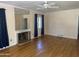 Living room with hardwood floors, fireplace and ceiling fan at 1526 W Wilshire Dr, Phoenix, AZ 85007