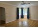 Bright living room with hardwood floors and ceiling fan at 1526 W Wilshire Dr, Phoenix, AZ 85007