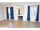 Bright living room featuring hardwood floors and a fireplace at 1526 W Wilshire Dr, Phoenix, AZ 85007