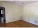 Simple living room with hardwood floors and neutral walls at 1526 W Wilshire Dr, Phoenix, AZ 85007