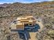 Aerial view of a large house under construction, showcasing its unique design and expansive setting at 15728 N Mountain Pkwy, Fountain Hills, AZ 85268
