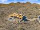 Aerial view of a house under construction with a pool, in a desert mountain setting at 15728 N Mountain Pkwy, Fountain Hills, AZ 85268