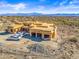 Aerial view of a house under construction with mountain views and a large yard at 15728 N Mountain Pkwy, Fountain Hills, AZ 85268