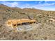 Aerial view of a large house under construction with a pool, in a desert mountain setting at 15728 N Mountain Pkwy, Fountain Hills, AZ 85268
