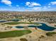 Community overview; golf course, lake, and homes visible at 15996 W Mesquite Ct, Surprise, AZ 85374
