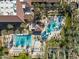 Resort-style pool with palm trees, a lap pool, and bocce ball courts at 15996 W Mesquite Ct, Surprise, AZ 85374