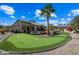 Putting green and patio in a sunny backyard at 15996 W Mesquite Ct, Surprise, AZ 85374
