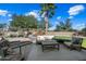 Landscaped backyard with seating and putting green at 15996 W Mesquite Ct, Surprise, AZ 85374