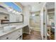 Bathroom with walk-in shower and modern vanity at 15996 W Mesquite Ct, Surprise, AZ 85374