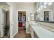 Bathroom with double vanity and large closet at 15996 W Mesquite Ct, Surprise, AZ 85374