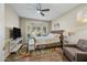 Spacious bedroom with large windows and sitting area at 15996 W Mesquite Ct, Surprise, AZ 85374