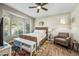 Bright bedroom with bay window and sitting area at 15996 W Mesquite Ct, Surprise, AZ 85374