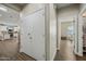 Bright hallway with kitchen view and access to office and other rooms at 15996 W Mesquite Ct, Surprise, AZ 85374