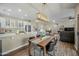 Open kitchen with island and modern appliances, adjacent to dining area at 15996 W Mesquite Ct, Surprise, AZ 85374