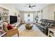 Living room with a large TV and comfortable seating at 15996 W Mesquite Ct, Surprise, AZ 85374
