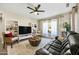 Bright living room with a cozy seating area and built-in shelving at 15996 W Mesquite Ct, Surprise, AZ 85374